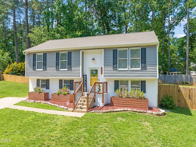 bi-level home featuring stucco siding