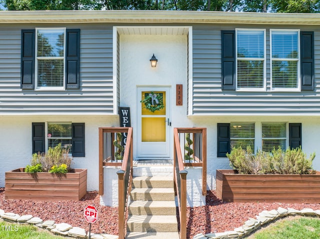 split foyer home with brick siding