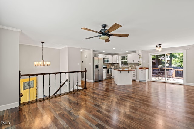unfurnished living room with a chandelier, dark wood-style flooring, recessed lighting, a ceiling fan, and crown molding