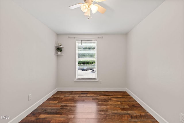 empty room featuring a ceiling fan, wood finished floors, and baseboards