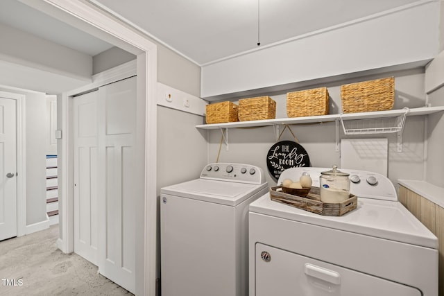 washroom featuring washing machine and clothes dryer