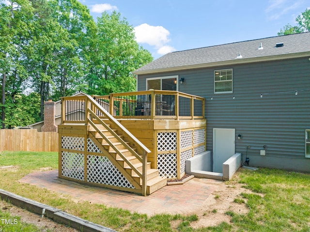back of house featuring a wooden deck, fence, stairs, a shingled roof, and a patio area