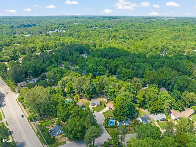 aerial overview of property's location featuring a forest