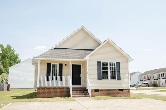 12 Linsey Ct, Lillington, NC 27546 - view of front facade featuring crawl space, a porch, and roof with shingles