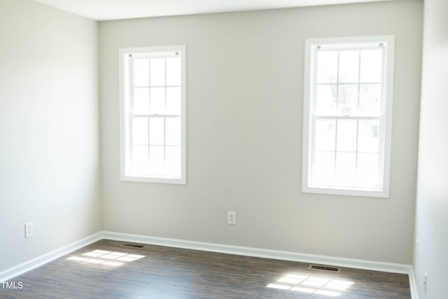 12 Linsey Ct, Lillington, NC 27546 - unfurnished room with baseboards, healthy amount of natural light, and wood finished floors