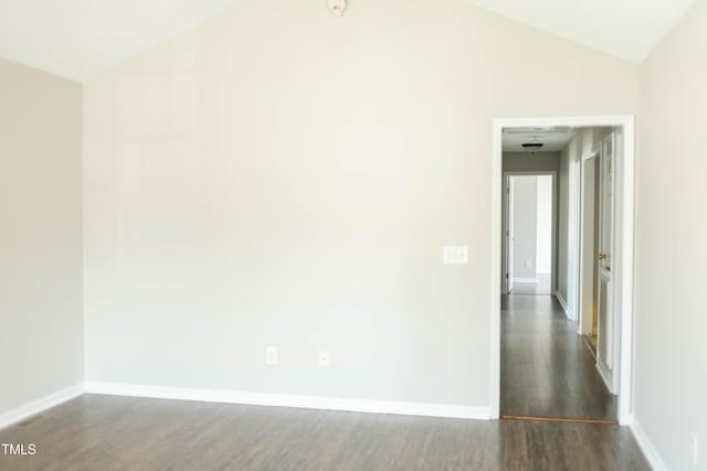 12 Linsey Ct, Lillington, NC 27546 - empty room featuring dark wood-type flooring, baseboards, and lofted ceiling