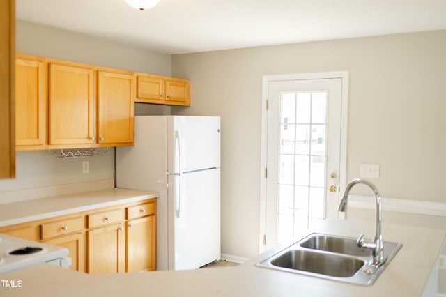 12 Linsey Ct, Lillington, NC 27546 - kitchen with a sink, white appliances, light brown cabinetry, and light countertops