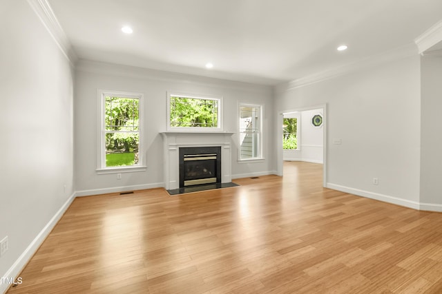 2819 Ellis Chapel Rd, Bahama, NC 27503 - unfurnished living room featuring ornamental molding, a fireplace with flush hearth, baseboards, light wood-style floors, and recessed lighting
