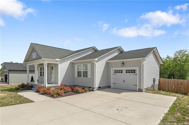 446 Placid Pond Dr, Broadway, NC 27505 - view of front of home featuring an attached garage, fence, a shingled roof, and concrete driveway
