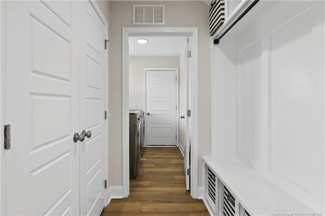 446 Placid Pond Dr, Broadway, NC 27505 - mudroom with dark wood-type flooring, baseboards, and washer / clothes dryer