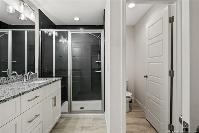 446 Placid Pond Dr, Broadway, NC 27505 - bathroom with a shower stall, toilet, vanity, and recessed lighting