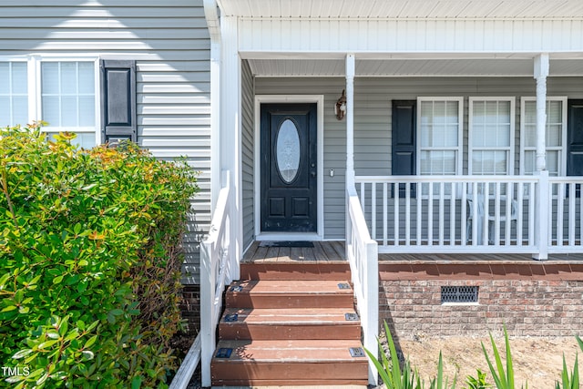 doorway to property with a porch