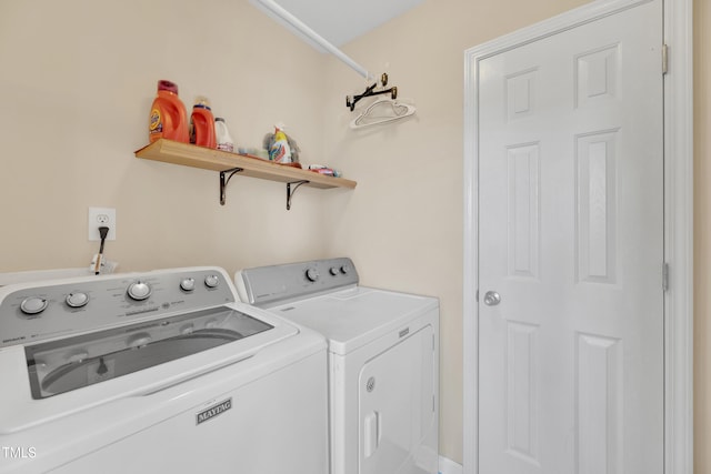 laundry area with washing machine and dryer
