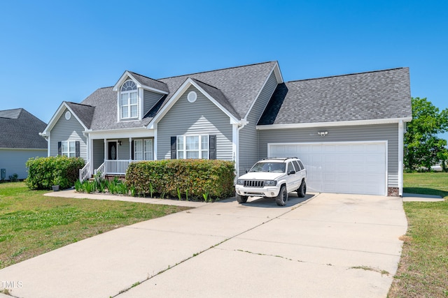 view of front facade with an attached garage, a front lawn, roof with shingles, and driveway