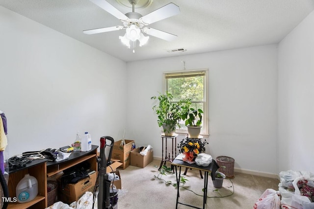 miscellaneous room with carpet floors, baseboards, and ceiling fan