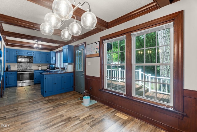 1100 Cardinals Knob, Rocky Mount, NC 27804 - kitchen with blue cabinetry, stainless steel range with electric cooktop, black microwave, dark countertops, and a chandelier