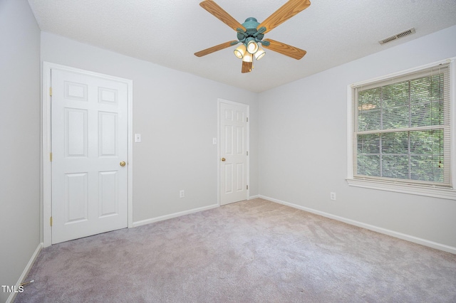 unfurnished room with carpet floors, ceiling fan, and baseboards