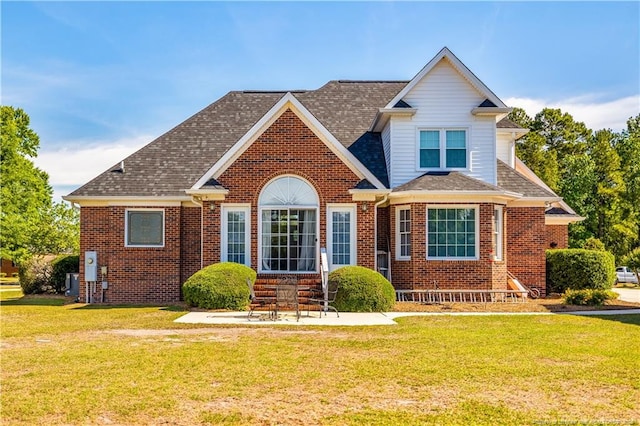 1110 Oakridge Blvd, Lumberton, NC 28358 - view of front of property with brick siding, a front lawn, and a patio area