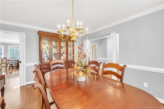 1110 Oakridge Blvd, Lumberton, NC 28358 - dining room featuring a chandelier, wood finished floors, and crown molding