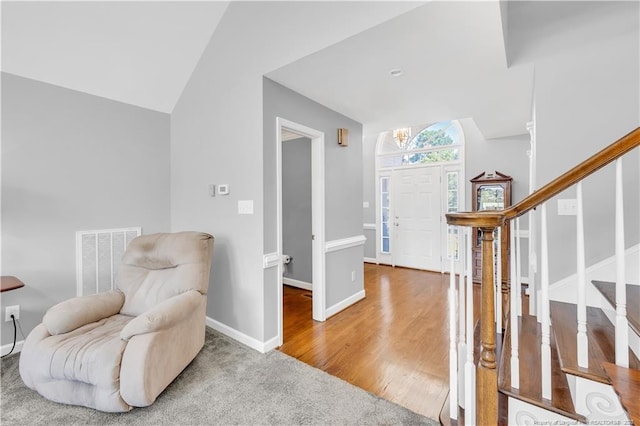 1110 Oakridge Blvd, Lumberton, NC 28358 - sitting room featuring lofted ceiling, stairs, baseboards, and wood finished floors