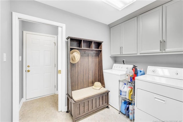 1110 Oakridge Blvd, Lumberton, NC 28358 - laundry room featuring separate washer and dryer, cabinet space, and baseboards