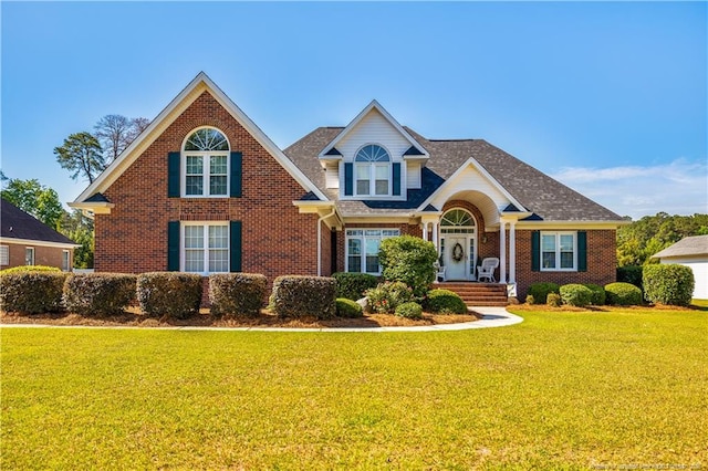 1110 Oakridge Blvd, Lumberton, NC 28358 - traditional-style home featuring brick siding and a front lawn
