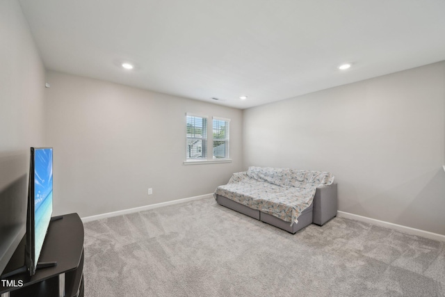 sitting room featuring carpet floors, baseboards, and recessed lighting
