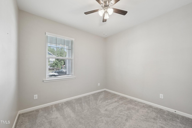 unfurnished room with carpet, baseboards, and ceiling fan