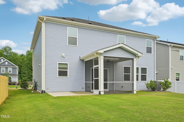 back of house featuring a sunroom and a patio