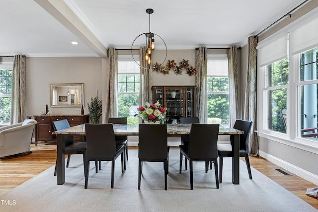 dining area with ornamental molding, a chandelier, light wood finished floors, recessed lighting, and baseboards