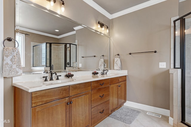 bathroom featuring a stall shower, baseboards, double vanity, ornamental molding, and tile patterned floors