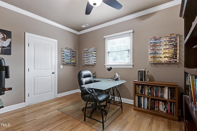 office space featuring wood finished floors, baseboards, ornamental molding, and a ceiling fan