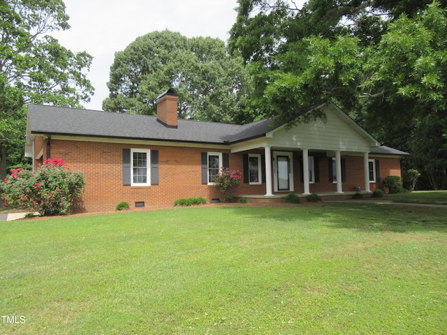 819 Patterson Grove Rd, Ramseur, NC 27316 - ranch-style house with covered porch, brick siding, a front lawn, crawl space, and a chimney