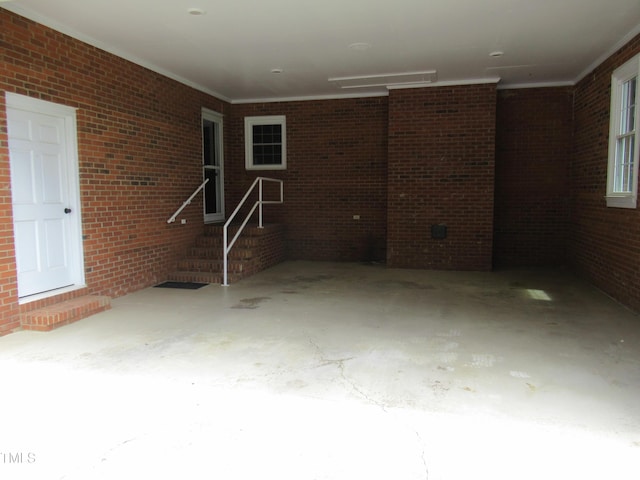 819 Patterson Grove Rd, Ramseur, NC 27316 - exterior space with brick wall and unfinished concrete floors