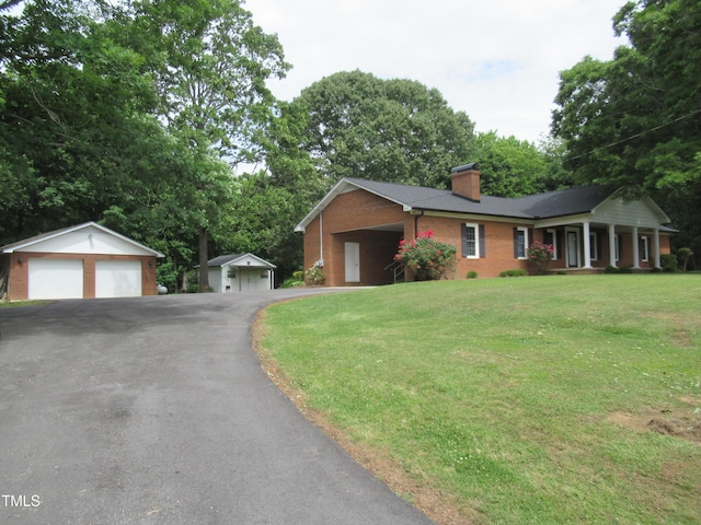 819 Patterson Grove Rd, Ramseur, NC 27316 - ranch-style home with a chimney, an outdoor structure, a front yard, brick siding, and a detached garage