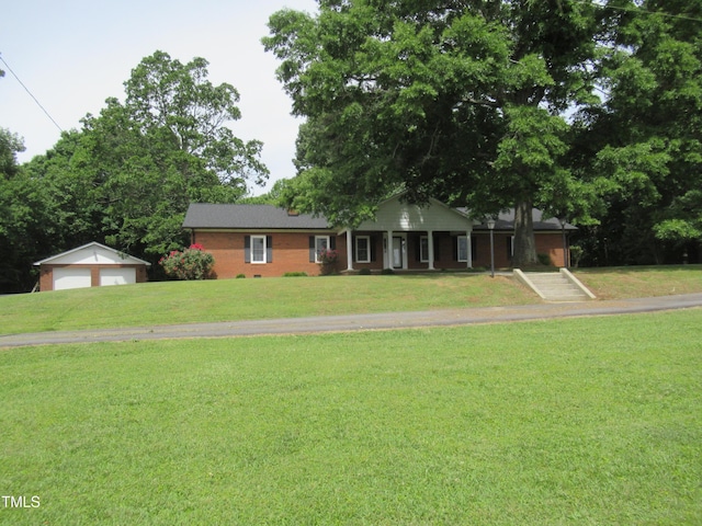 819 Patterson Grove Rd, Ramseur, NC 27316 - ranch-style house with an outdoor structure, a front yard, a garage, and a porch