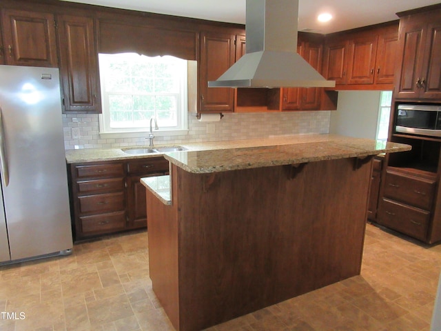 819 Patterson Grove Rd, Ramseur, NC 27316 - kitchen featuring stainless steel appliances, island exhaust hood, a sink, and tasteful backsplash