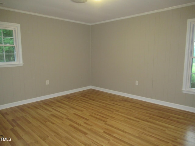 819 Patterson Grove Rd, Ramseur, NC 27316 - spare room with light wood finished floors, healthy amount of natural light, crown molding, baseboards, and wooden walls