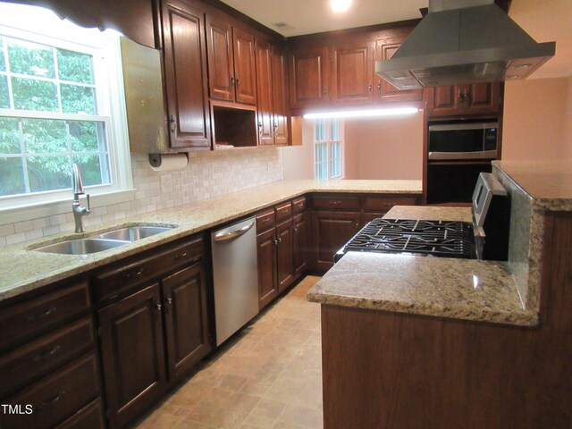 819 Patterson Grove Rd, Ramseur, NC 27316 - kitchen with island range hood, a sink, stainless steel appliances, tasteful backsplash, and light stone countertops