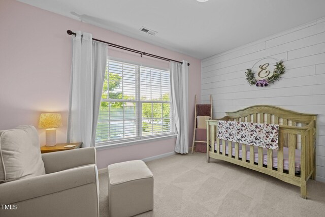 2012 Sterling Hill Dr, Fuquay Varina, NC 27526 - bedroom with carpet flooring, wooden walls, baseboards, and a nursery area