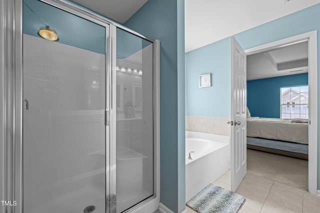 2012 Sterling Hill Dr, Fuquay Varina, NC 27526 - ensuite bathroom featuring tile patterned flooring, a stall shower, and a bath