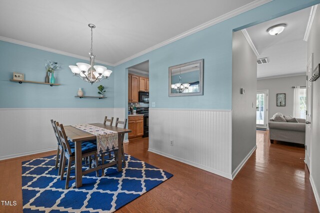 2012 Sterling Hill Dr, Fuquay Varina, NC 27526 - dining room featuring a chandelier, dark wood-style floors, wainscoting, crown molding, and baseboards