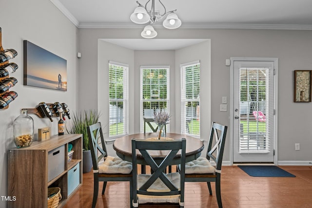 2012 Sterling Hill Dr, Fuquay Varina, NC 27526 - dining room featuring a chandelier, wood-type flooring, plenty of natural light, ornamental molding, and baseboards