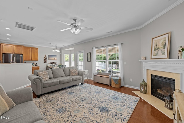 2012 Sterling Hill Dr, Fuquay Varina, NC 27526 - living area with ornamental molding, wood finished floors, a ceiling fan, a fireplace, and baseboards