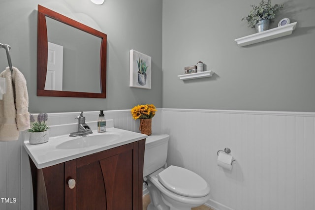 2012 Sterling Hill Dr, Fuquay Varina, NC 27526 - half bath with a wainscoted wall, toilet, and vanity