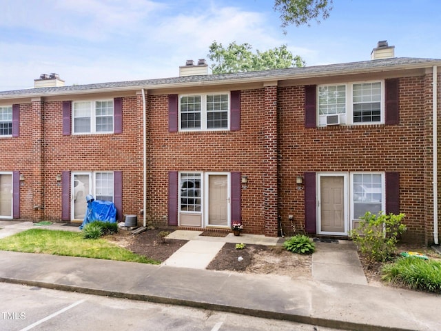 145 Coleridge Ct, Carrboro, NC 27510 - multi unit property featuring a chimney, brick siding, and central AC unit