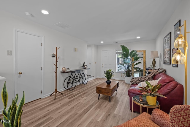145 Coleridge Ct, Carrboro, NC 27510 - living room with light wood finished floors and recessed lighting