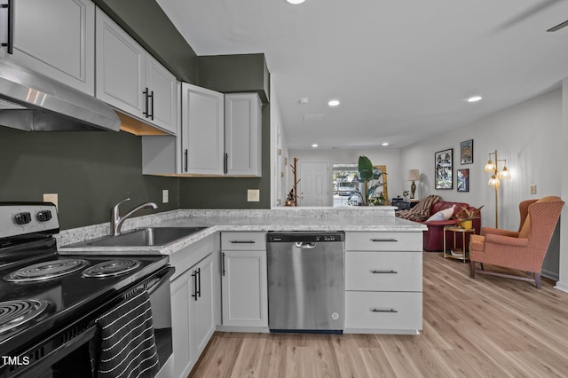 145 Coleridge Ct, Carrboro, NC 27510 - kitchen with stainless steel dishwasher, electric stove, a sink, light wood-style floors, and white cabinetry