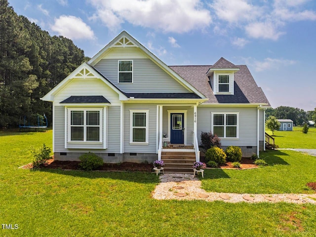 view of front of property with crawl space, a shingled roof, and a front yard