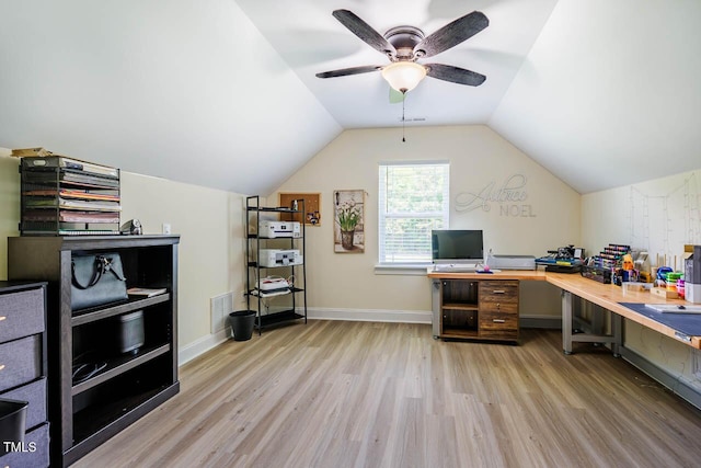 office with wood finished floors, a ceiling fan, vaulted ceiling, and baseboards